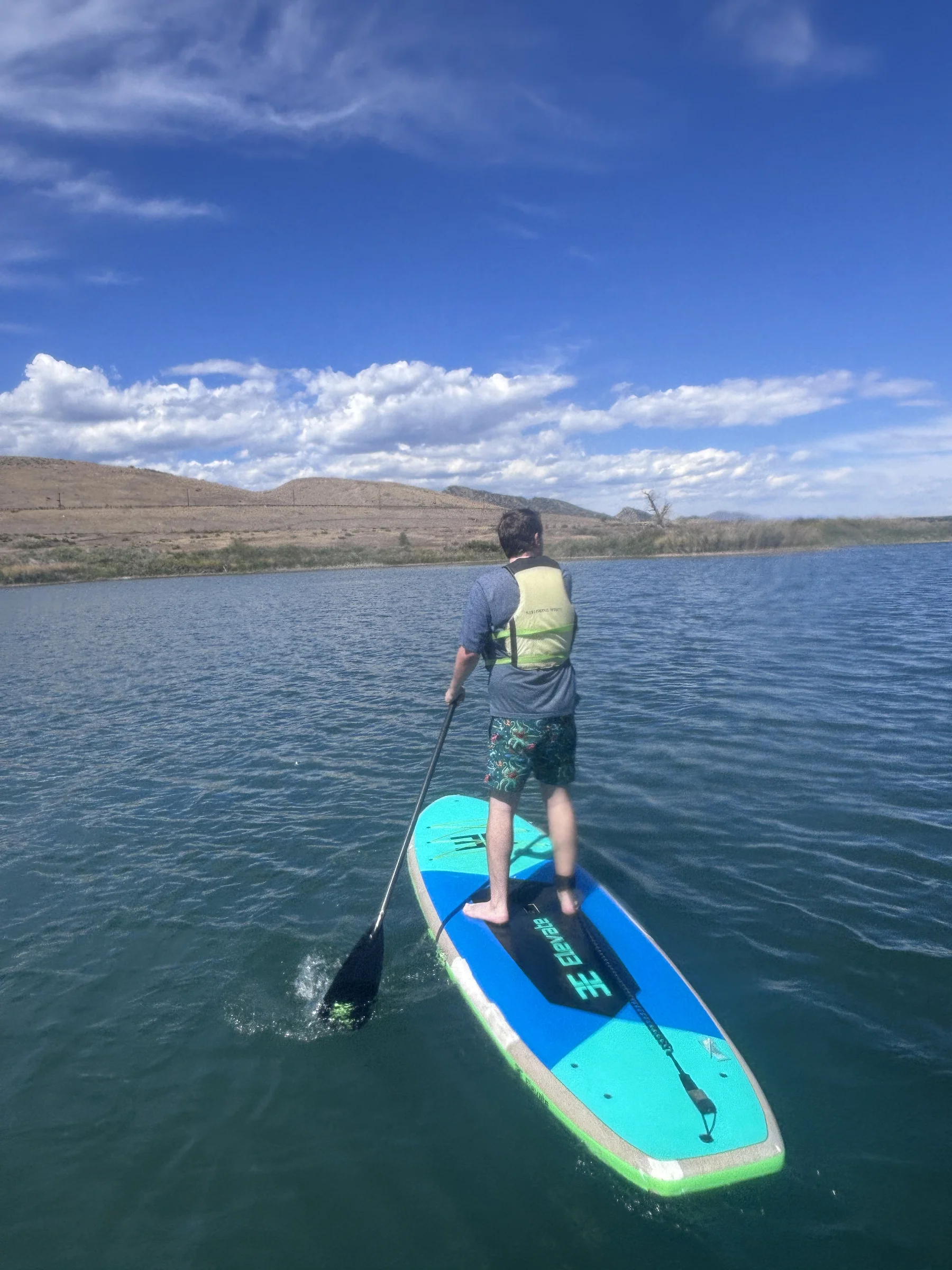 Henry paddleboarding at the lake